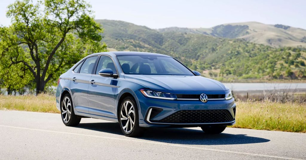 The 2025 Volkswagen Jetta SEL compact sedan in Monterey Blue Pearl parked on the side of the road.