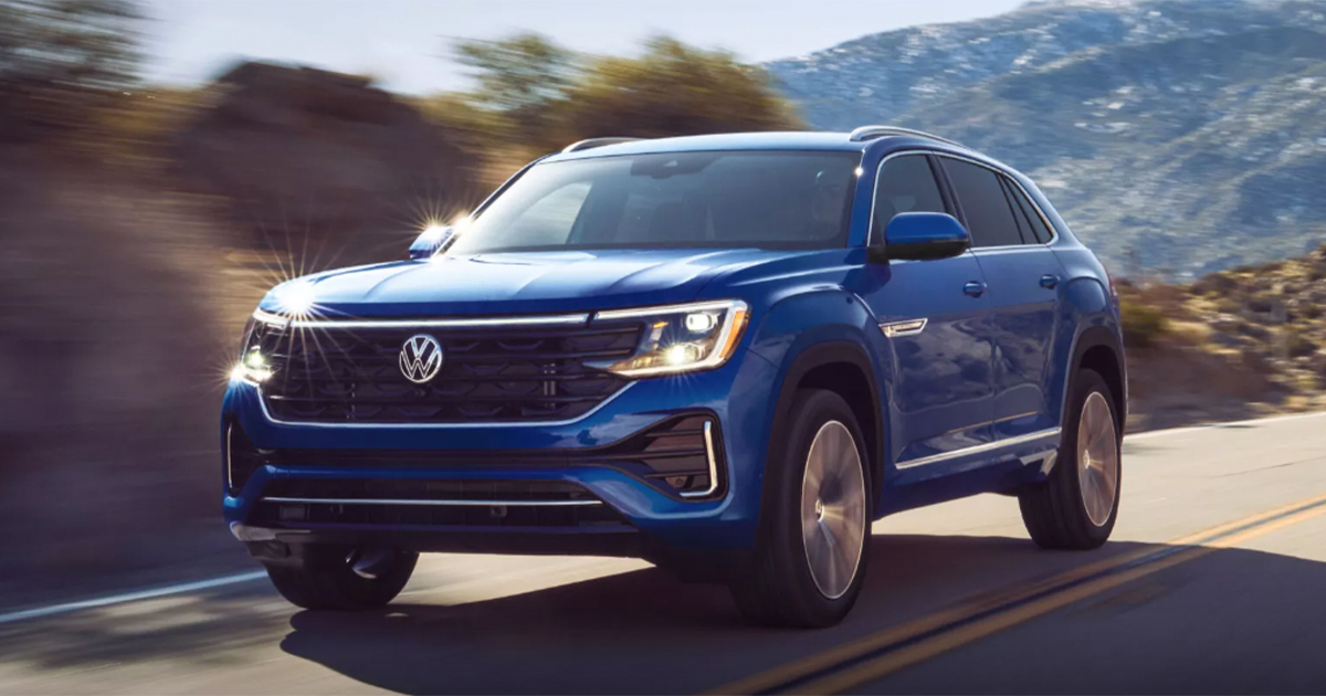 A blue Volkswagen Atlas Cross Sport on the road during the day