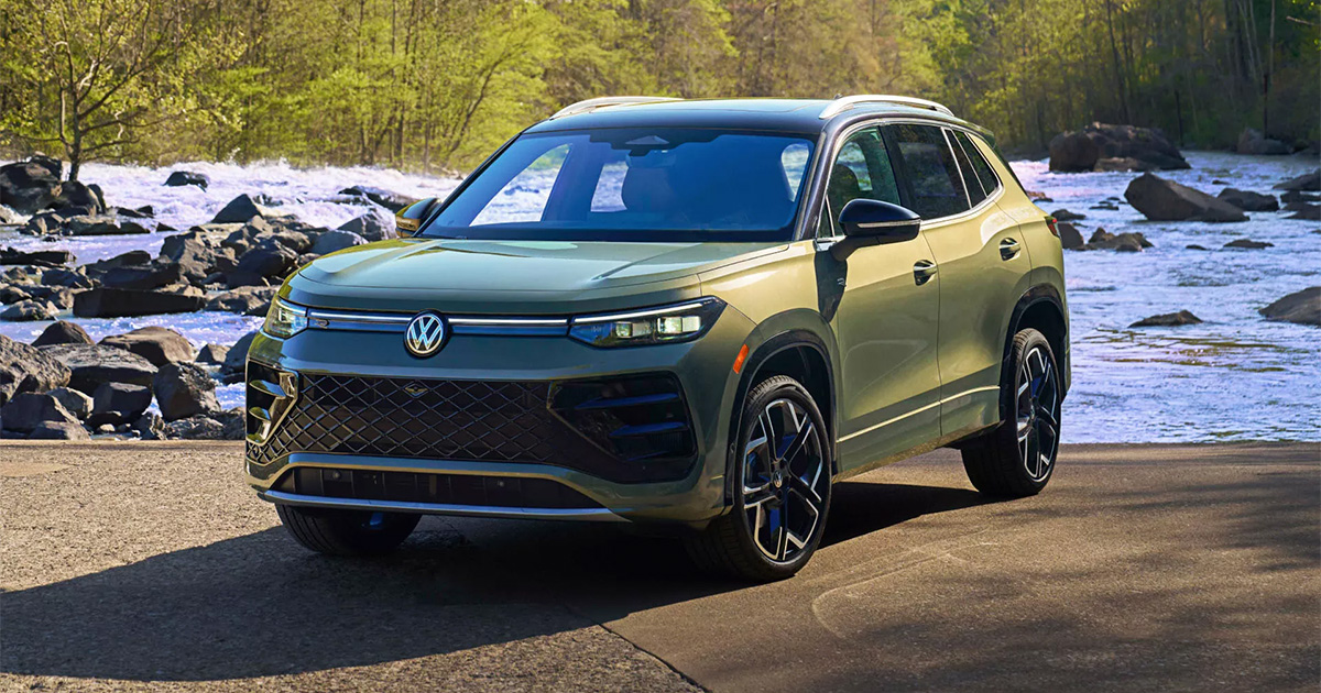 A Volkswagen Tiguan parked by a river.