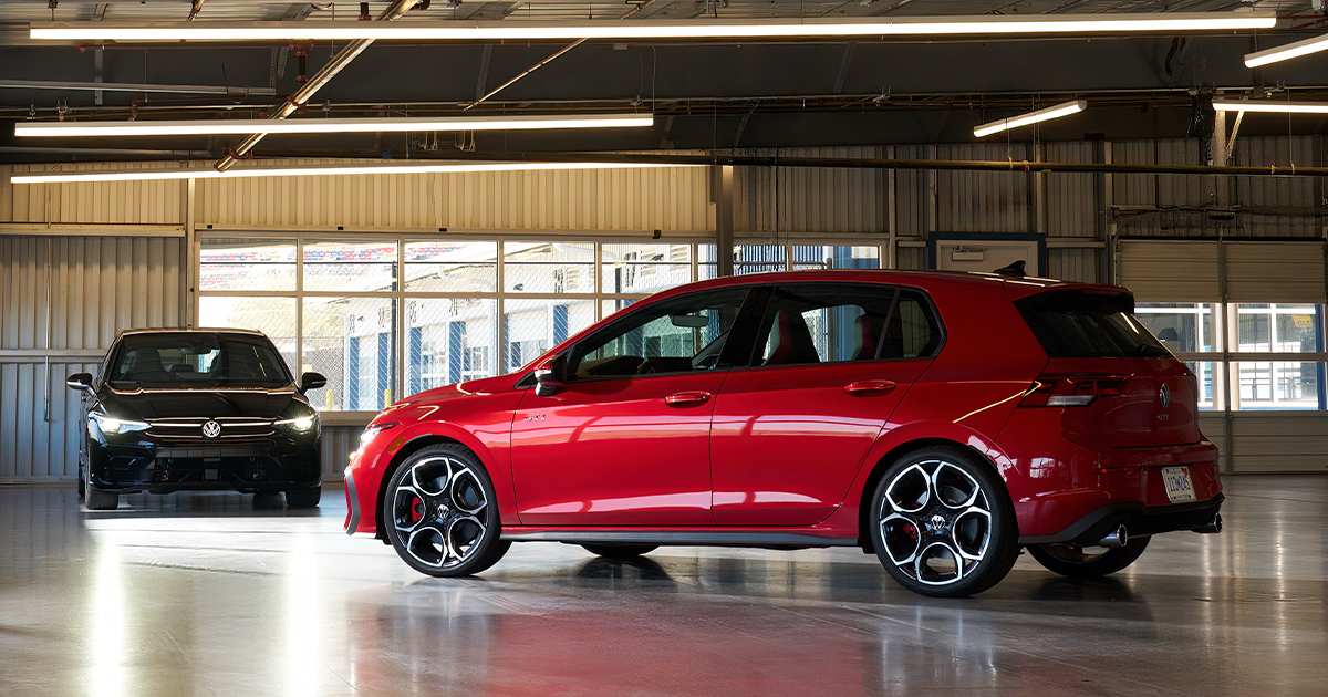 A red Volkswagen Golf GTI parked in a building.